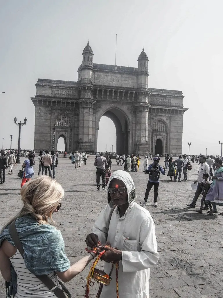 Anne getting a "blessing" near the Gateway of India