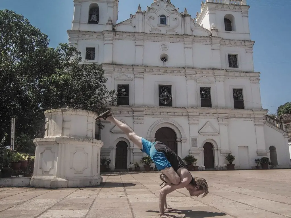 Flying Squirrel pose - near a beautiful Aldona Church