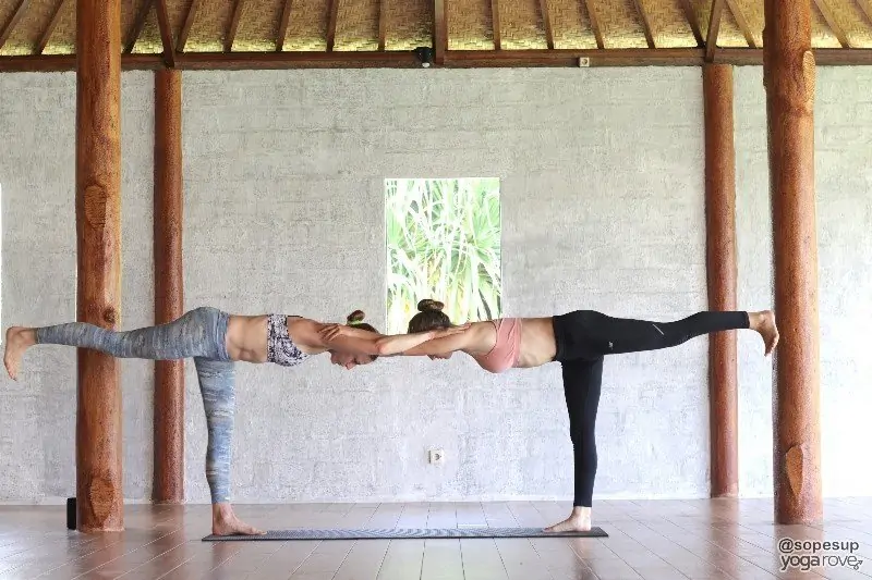 Partner Up: Explore 15 Best And Easy 2 Person Yoga Poses! 2 person yoga poses 24 warrior ii