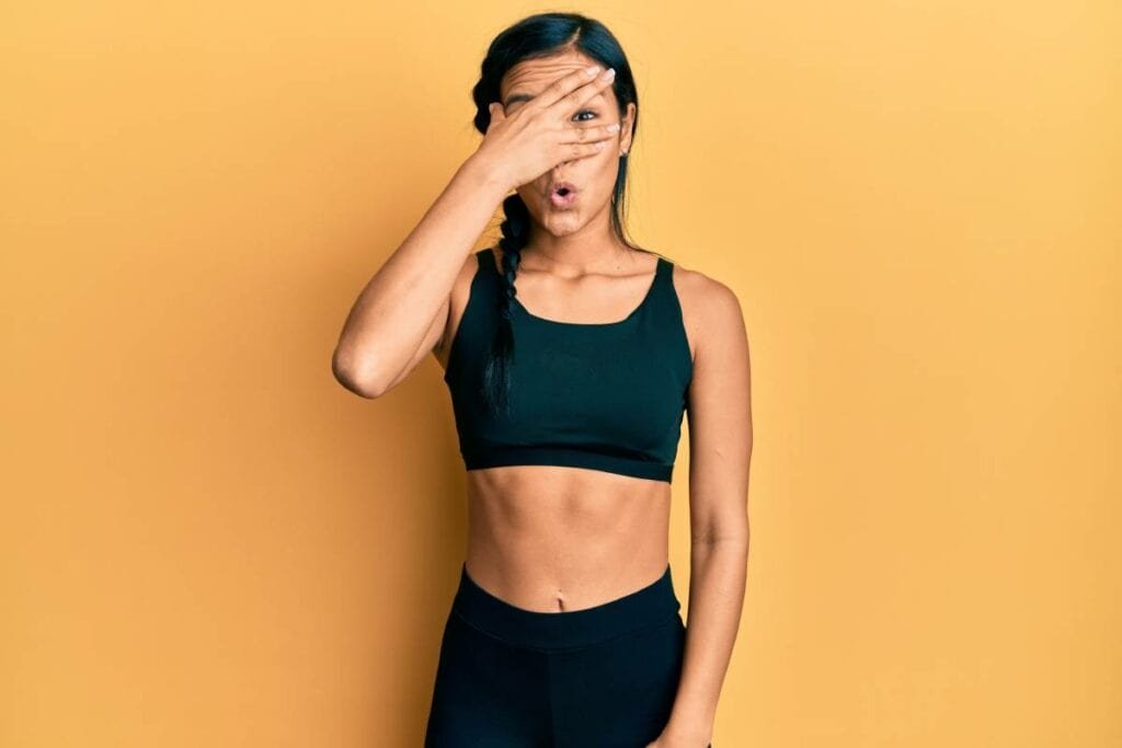 Best 16 Ways To Prevent Camel Toe in Yoga Pants and Bathing Suit prevent camel toe 1 embarrassed woman in athletic clothing