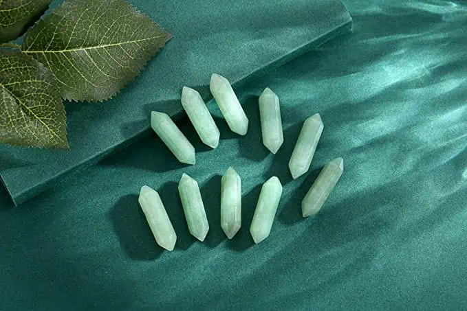 Green Aventurine, known as the 'Stone of Opportunity,' channels abundance and prosperity, especially concerning finances.
