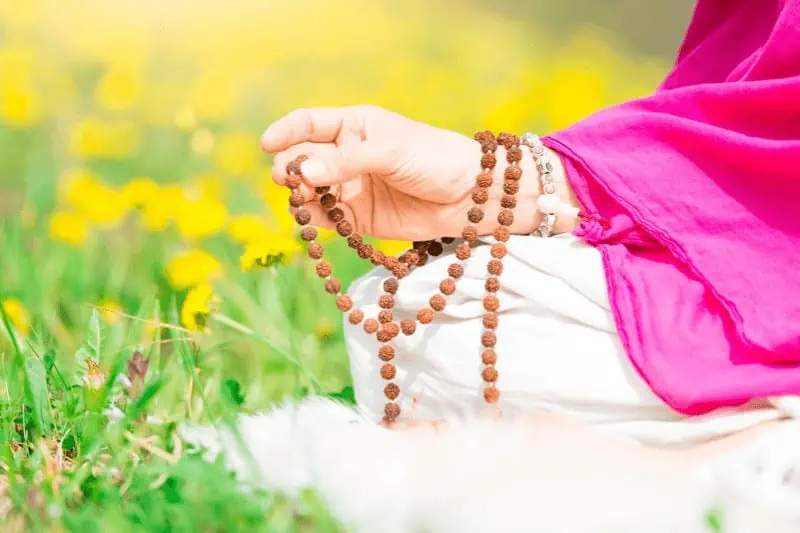 Use of mala beads in yoga meditation and matra chanting are still common today; these practices developed from Vedic rituals
