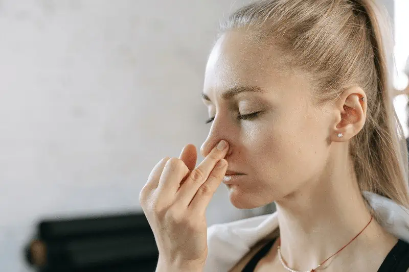 https://www.pexels.com/photo/a-woman-doing-nostril-breathing-6648567/