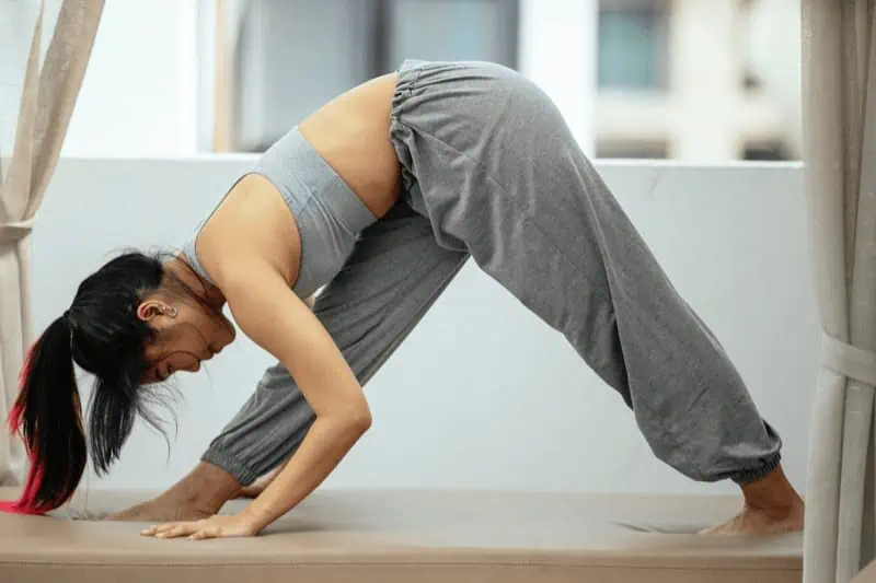 In Pyramid Pose, focus on bringing the chest onto the thigh rather than taking your forehead to your knee.