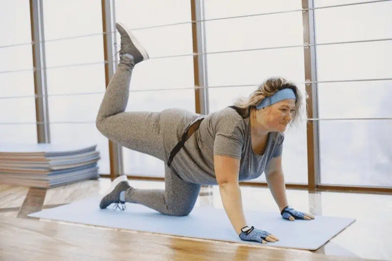 In traditional Tiger Pose or Vyaghrasana, both hands remain on the floor to support and balance your weight as one leg lifts.