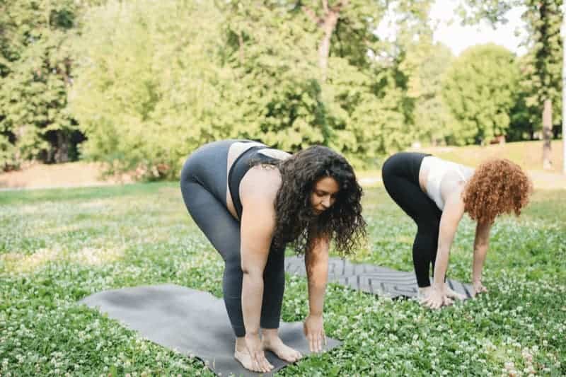 A simple modification for Ardha Uttanasana is to keep your knees bent, allowing you to lengthen your spine without strain.