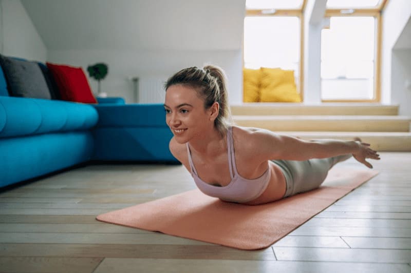 For proper Shalabasana alignment, lift and open your chest and reach through the top of your head to lengthen the spine.