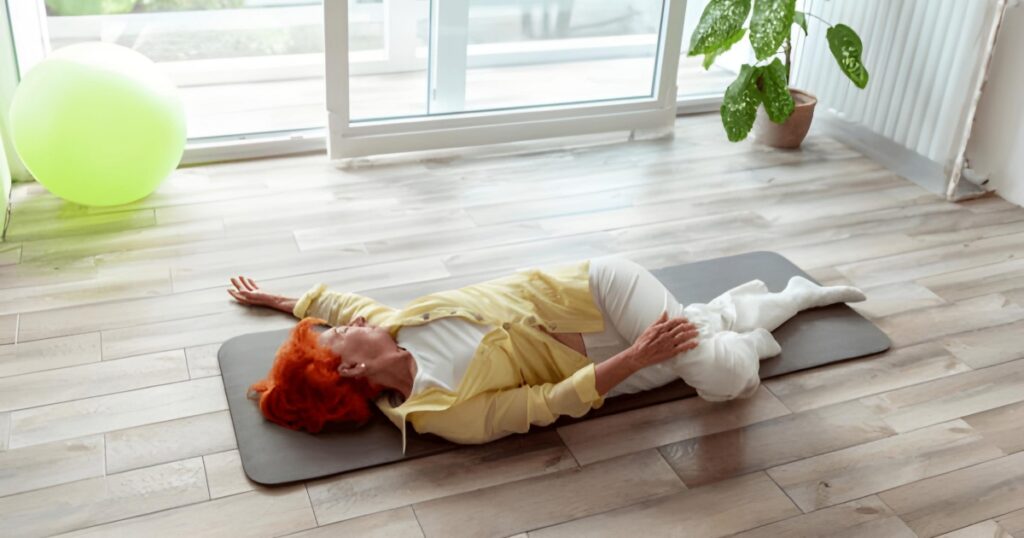 The Supine Twist or Supta Matsyendrasana is a reclining yoga pose that involves twisting the spine while lying down.