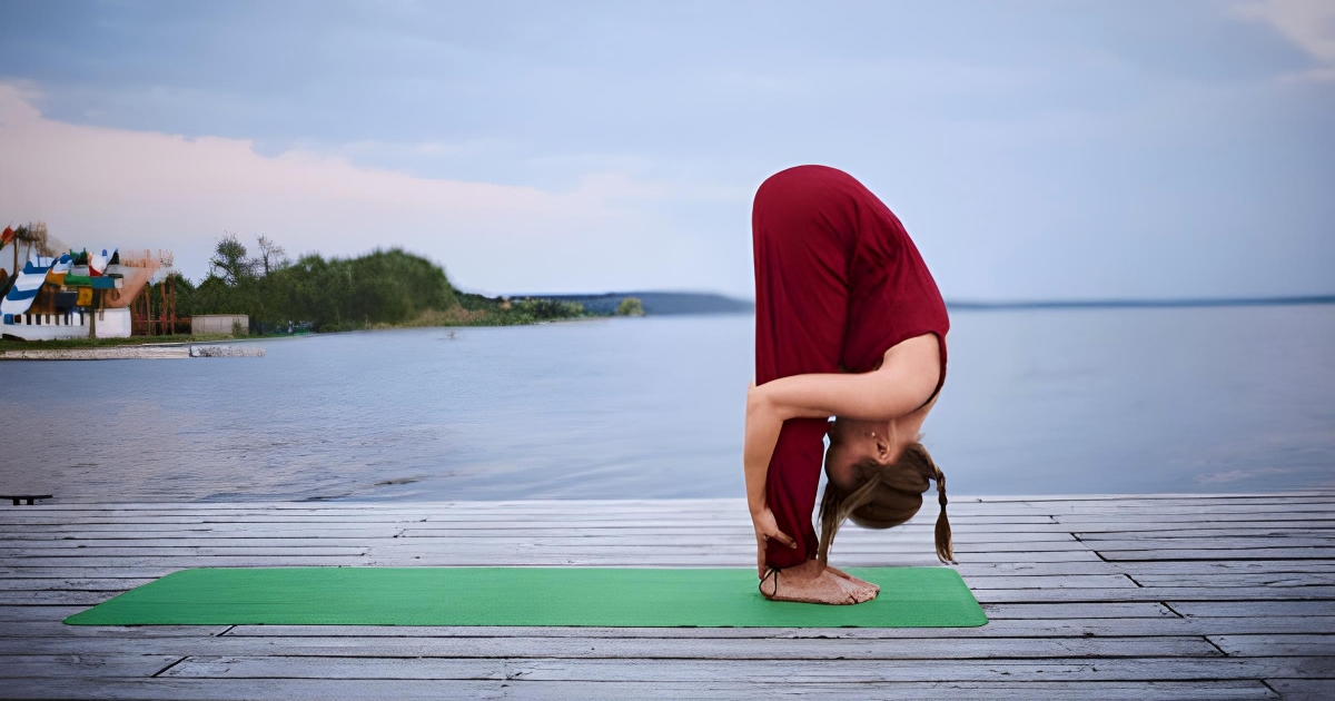 Uttanasana or Standing Forward Bend Pose is a foundational yoga asana that stretches the hamstrings and calms the mind.