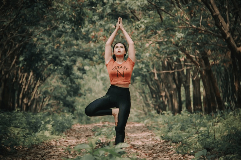 In Tree Pose, you balance on one leg to build strength, stability, and focus. Try different arm variations for added challenges.