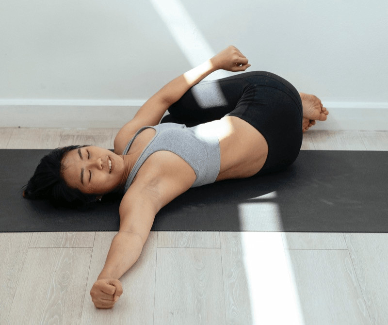 Supine Twist may be done with both knees together, depending on personal preference.