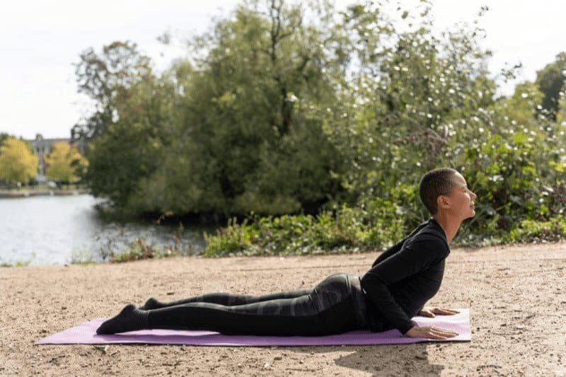 Unlock Potential: Elevate Your Practice with This Hatha Yoga Sequence of 15 Poses hatha yoga sequence 23 Cobra Pose is a prone heart-opening yoga pose accessible for yoga beginners.