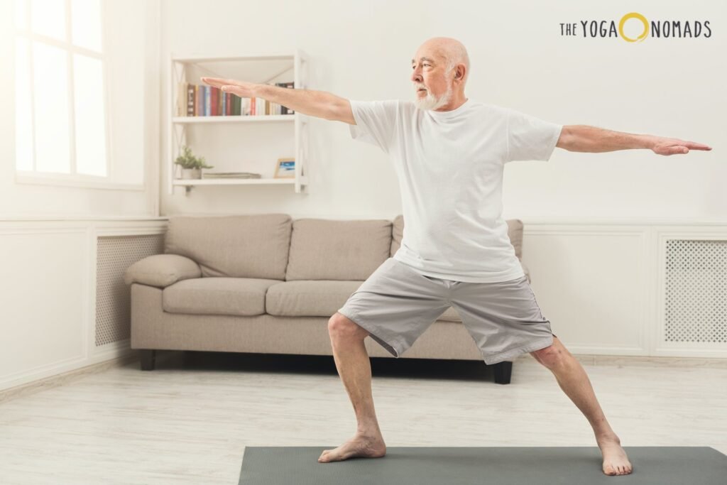 Comprehensive Guide to Yoga for Joint Pain yoga for joint pain 2 An elderly person practices yoga in a cozy living room, performing the Warrior II pose on a yoga mat. Their arms are extended horizontally, and legs firmly grounded, demonstrating balance and strength. The room features a beige sofa, a white bookshelf with books and plants, and a large window letting in natural light. The calm and welcoming atmosphere highlights how yoga can be adapted at home to improve flexibility and joint health."
I’ve now forgotten about this image, so feel free to send me the next one.